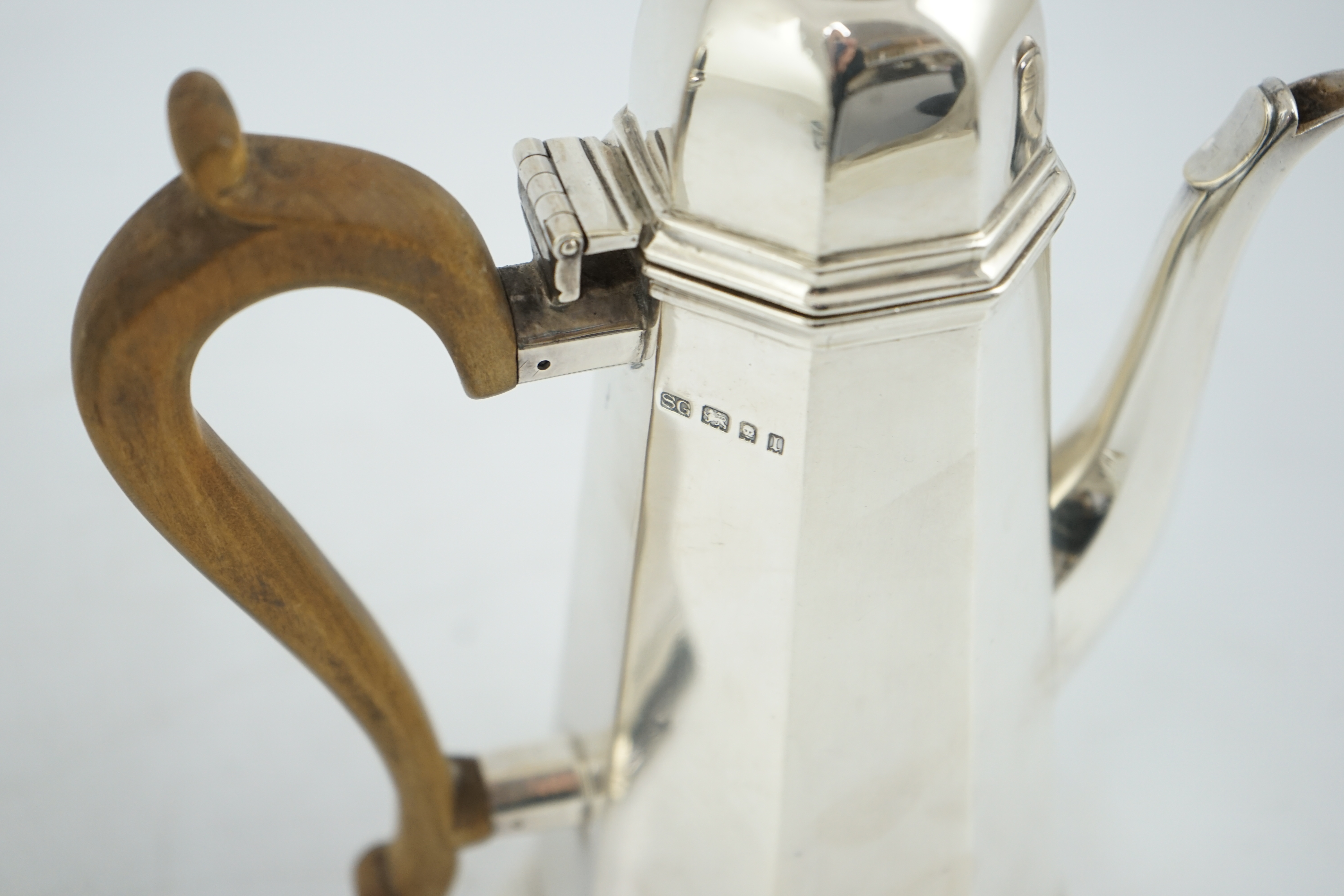 A George V 18th century style silver cafe au lait pair by Garrard & Co